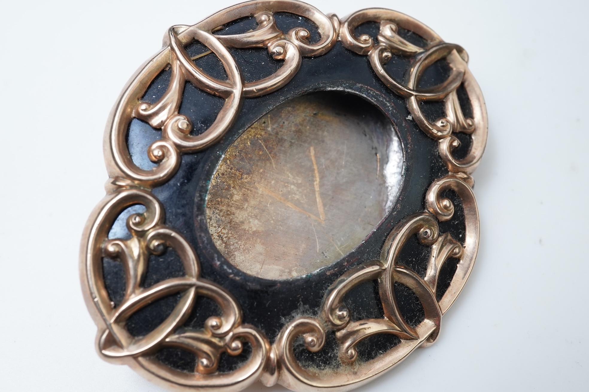 A Victorian rolled gold and enamel locket brooch/pendant, late 19th century